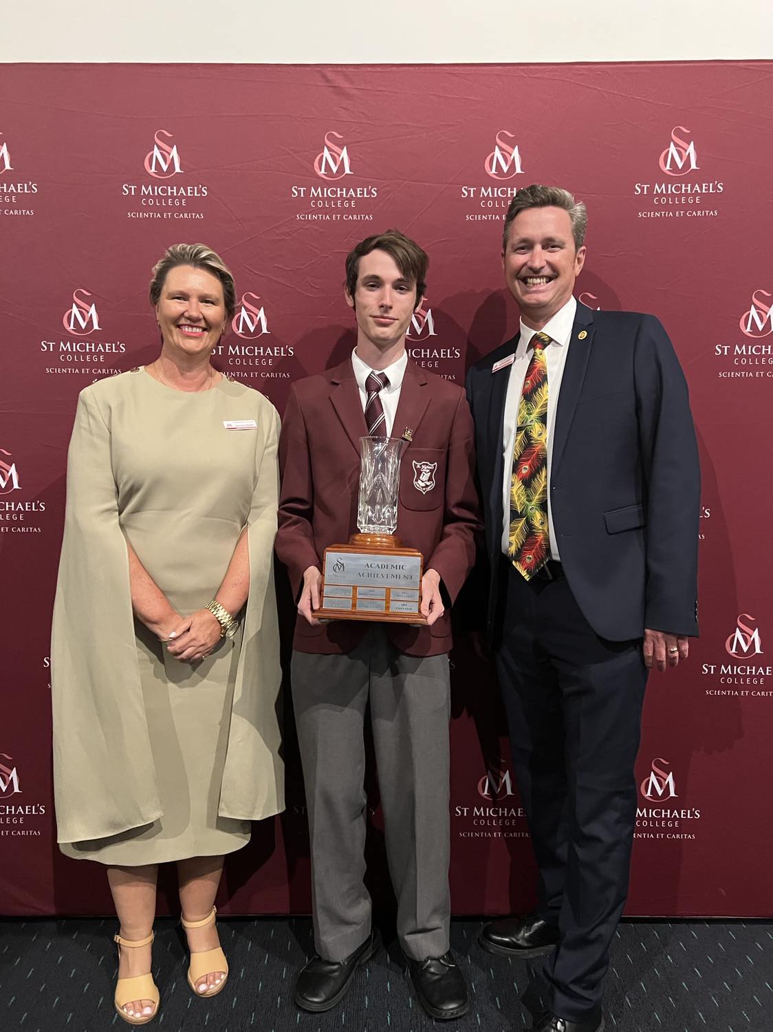 Student receiving academic achievement award at Evening of Excellence ceremony