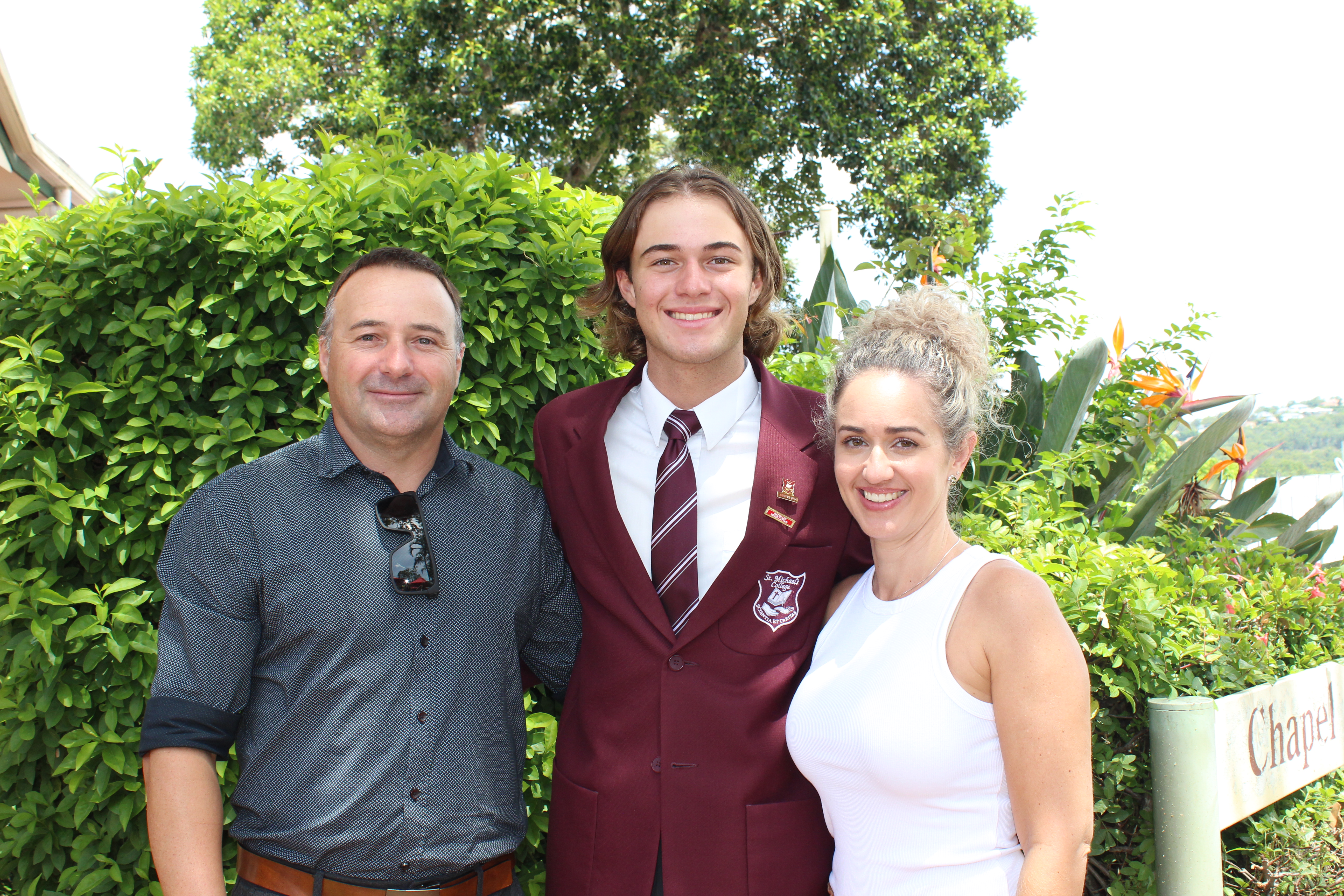 Students with family member during 2024 commencement Mass