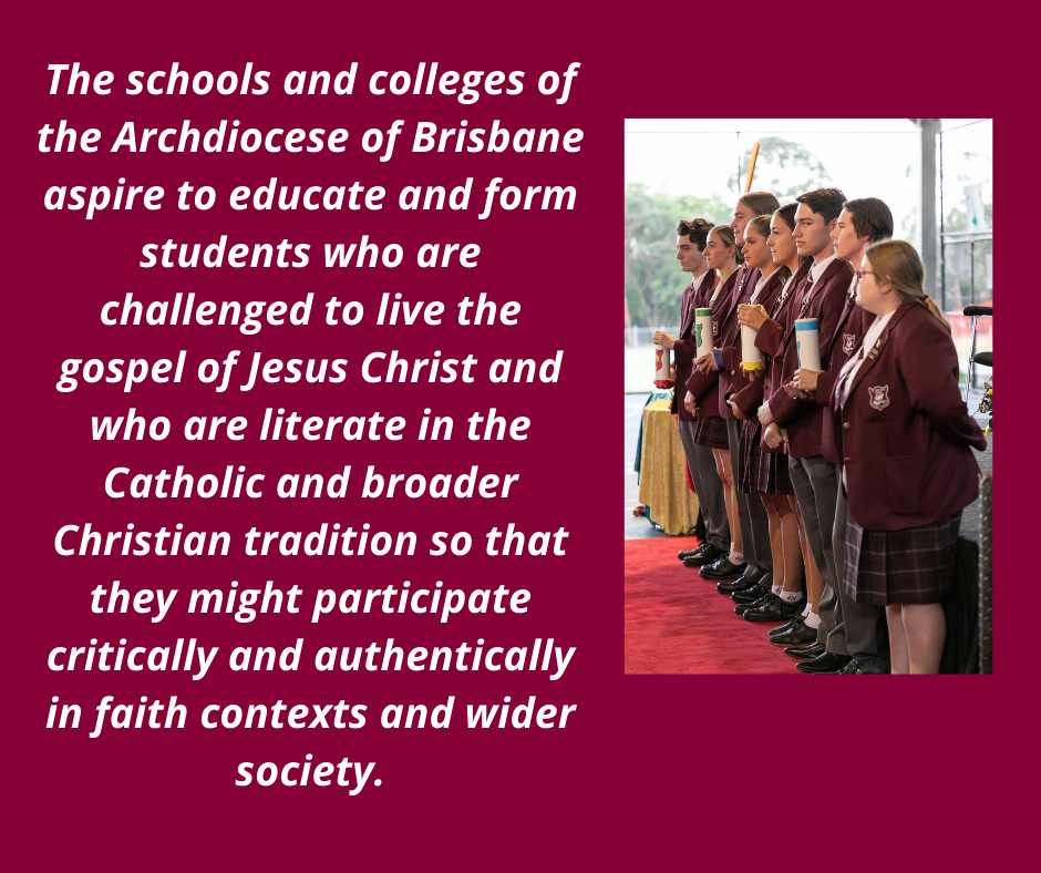 Students in school uniform standing together during a school ceremony while holding candles beside a mission statement about Catholic education